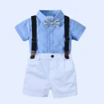 Svečani fantovski komplet s srajčko, metuljčkom, naramnicami in hlačami v modri barvi