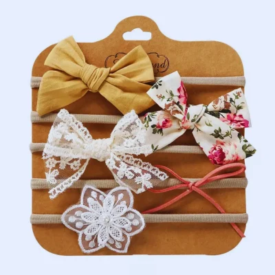 Komplet 5 dekorativnih naglavnih trakov za punčke – oranžna barva.