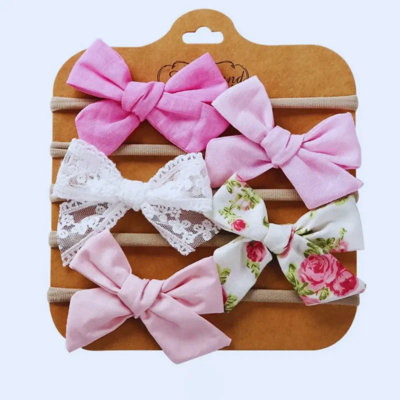 Komplet 5 dekorativnih naglavnih trakov za punčke – roza barva.