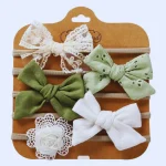 Komplet 5 dekorativnih naglavnih trakov za punčke – zelena barva.