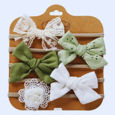 Komplet 5 dekorativnih naglavnih trakov za punčke – zelena barva.