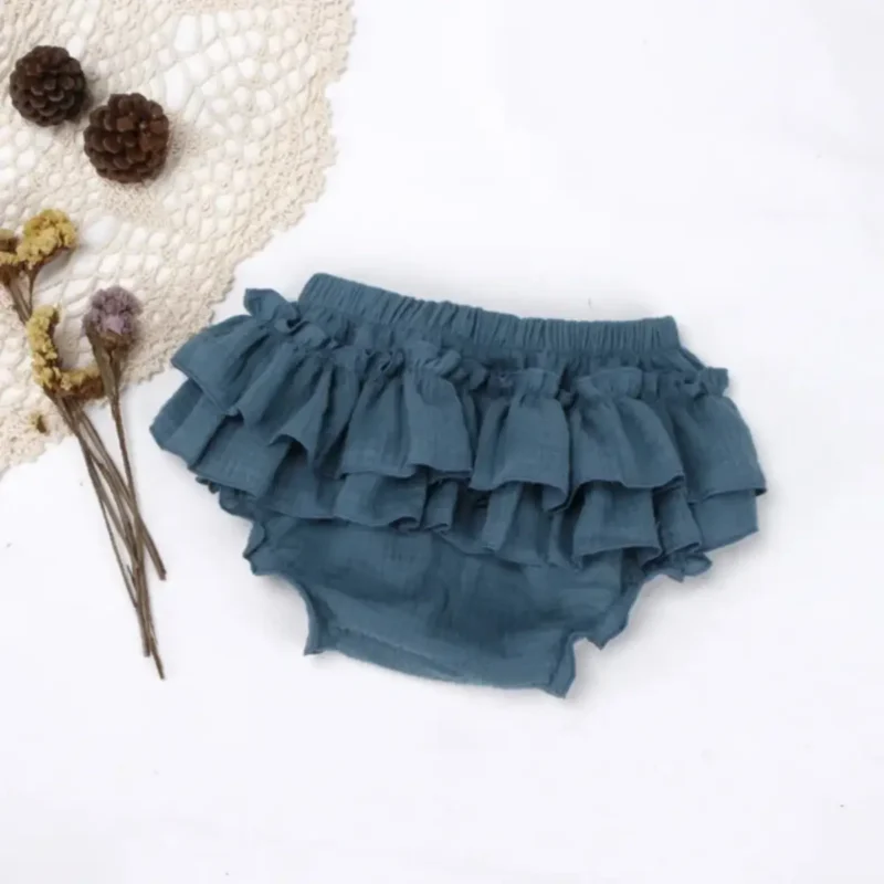 Hlačke ruffle turkizna